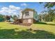 Spacious backyard featuring a grill, wooden picnic table, and mulched ground at 364 Chinaberry Ln, Angier, NC 27501