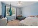 Bedroom with light blue walls, two twin beds, and a window at 364 Chinaberry Ln, Angier, NC 27501