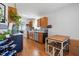 Well-lit kitchen featuring wooden cabinets, stainless steel appliances, and wooden flooring at 364 Chinaberry Ln, Angier, NC 27501