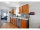 Bright kitchen with a stainless steel dishwasher and mosaic backsplash at 364 Chinaberry Ln, Angier, NC 27501