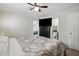 Main bedroom with patterned comforter, TV, and attached bathroom at 364 Chinaberry Ln, Angier, NC 27501