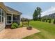 Backyard patio with a swing and brick firepit, ideal for outdoor entertaining and relaxing at 367 Tayside St, Clayton, NC 27520