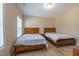 Bedroom featuring two beds with matching wood headboards, offering a comfortable and inviting space at 367 Tayside St, Clayton, NC 27520
