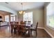 Cozy dining area with fireplace and backyard access through glass doors at 367 Tayside St, Clayton, NC 27520