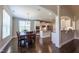 Open-concept dining area with hardwood floors seamlessly connects to the kitchen, offering a modern and functional design at 367 Tayside St, Clayton, NC 27520