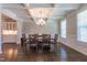 Spacious dining room with coffered ceiling, elegant chandelier and hardwood floors at 367 Tayside St, Clayton, NC 27520