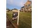Charming brick two-story home with well-manicured lawn and 'For Sale' sign at 367 Tayside St, Clayton, NC 27520