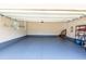 Spacious garage with painted floor, shelving, and ample room for parking and storage at 367 Tayside St, Clayton, NC 27520