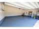 Well-maintained garage with painted floor, shelving, and utility connections at 367 Tayside St, Clayton, NC 27520