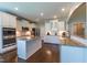 Spacious kitchen with white cabinets, stainless steel appliances, and granite countertops at 367 Tayside St, Clayton, NC 27520