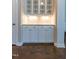 Elegant kitchen cabinetry with granite countertop, subway tile backsplash, and glass-front cabinets, offering style and functionality at 367 Tayside St, Clayton, NC 27520