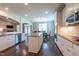 Open concept kitchen with stainless steel appliances and central island at 367 Tayside St, Clayton, NC 27520