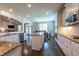 Open concept kitchen with stainless steel appliances and central island at 367 Tayside St, Clayton, NC 27520