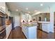 Bright kitchen features a large island, stainless steel appliances, and plenty of cabinet space at 367 Tayside St, Clayton, NC 27520