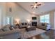 Spacious living room features a fireplace, high ceilings, ceiling fan, and hardwood floors, perfect for relaxation at 367 Tayside St, Clayton, NC 27520