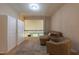 Cozy loft area with plush seating, built in cabinets, and views overlooking the main floor at 367 Tayside St, Clayton, NC 27520