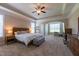 The main bedroom has neutral carpet and a tray ceiling with crown molding at 367 Tayside St, Clayton, NC 27520