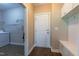 Mudroom with tile flooring, laundry machine and built in bench with storage at 367 Tayside St, Clayton, NC 27520