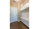 Mudroom featuring tile flooring, a built-in bench with storage and coat hooks, offering a functional space at 367 Tayside St, Clayton, NC 27520