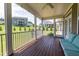 Relax on the covered porch overlooking the landscaped yard and neighboring houses at 367 Tayside St, Clayton, NC 27520