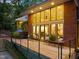 Lovely deck with chairs overlooking lush greenery, creating a relaxing outdoor space for entertaining at 3910 Somerset Dr, Durham, NC 27707
