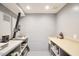 Functional basement space with ample storage and work surfaces, ideal for a workshop or hobbies at 3910 Somerset Dr, Durham, NC 27707
