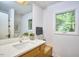 Bright bathroom with a modern vanity, stylish mirror, and a refreshing view of the outdoors at 3910 Somerset Dr, Durham, NC 27707