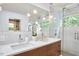 Chic bathroom boasts double vanity, quartz counters and modern fixtures at 3910 Somerset Dr, Durham, NC 27707