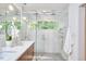 Elegant bathroom with a glass-enclosed shower and a double vanity at 3910 Somerset Dr, Durham, NC 27707