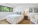 Bright bedroom with a large window, comfortable bed, and inviting decor, perfect for relaxation at 3910 Somerset Dr, Durham, NC 27707