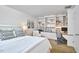 Spacious bedroom featuring built-in shelves and a dedicated workspace for productivity and comfort at 3910 Somerset Dr, Durham, NC 27707