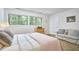 Serene bedroom with natural light, cozy sofa, and a charming decor, offering a relaxing retreat at 3910 Somerset Dr, Durham, NC 27707