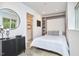 Bedroom featuring a built-in Murphy bed, closet, and a contemporary design at 3910 Somerset Dr, Durham, NC 27707