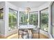 Sunlit breakfast nook featuring a round table and views of the surrounding trees at 3910 Somerset Dr, Durham, NC 27707