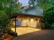 Attached carport with lighting provides covered parking and easy access to the house in this stunning home at 3910 Somerset Dr, Durham, NC 27707