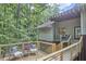 Relax on the spacious deck with seating and wooded views, perfect for enjoying the outdoors at 3910 Somerset Dr, Durham, NC 27707