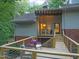 A beautiful wood deck with seating, perfect for enjoying the peaceful, wooded setting at 3910 Somerset Dr, Durham, NC 27707