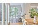 Bright, open foyer showcasing an upper level with railing and large windows offering leafy views at 3910 Somerset Dr, Durham, NC 27707