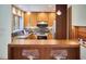 Well-lit kitchen featuring a view, granite countertops, and stainless steel appliances at 3910 Somerset Dr, Durham, NC 27707