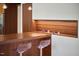 Stylish kitchen with custom wood breakfast bar, modern clear seating, and designer lighting at 3910 Somerset Dr, Durham, NC 27707