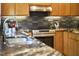 Contemporary kitchen with stainless steel oven and granite countertops at 3910 Somerset Dr, Durham, NC 27707
