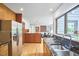 Open-concept kitchen with stainless steel appliances and a view into the living room at 3910 Somerset Dr, Durham, NC 27707
