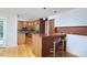 Modern kitchen with stainless steel appliances, wood cabinets and a breakfast bar at 3910 Somerset Dr, Durham, NC 27707