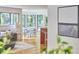 Cozy living room with modern furniture, bay windows, and hardwood floors, perfect for relaxing or entertaining at 3910 Somerset Dr, Durham, NC 27707