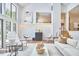 Living room featuring high ceilings, stylish chairs, and unique decor elements at 3910 Somerset Dr, Durham, NC 27707