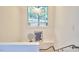 Staircase landing with a unique light fixture and view of the outdoors at 3910 Somerset Dr, Durham, NC 27707