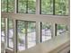 View through large picture windows to the elevated outdoor seating area at 3910 Somerset Dr, Durham, NC 27707