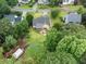 Aerial view showcasing the back yard, patio with outdoor seating, and lush landscaping at 3916 Rustic Mill Dr, Apex, NC 27539
