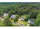Aerial view of the neighborhood showcases mature trees, winding streets, and manicured lawns at 3916 Rustic Mill Dr, Apex, NC 27539