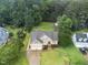 This aerial image highlights the two-car garage, landscaping, and well-maintained lawn at 3916 Rustic Mill Dr, Apex, NC 27539